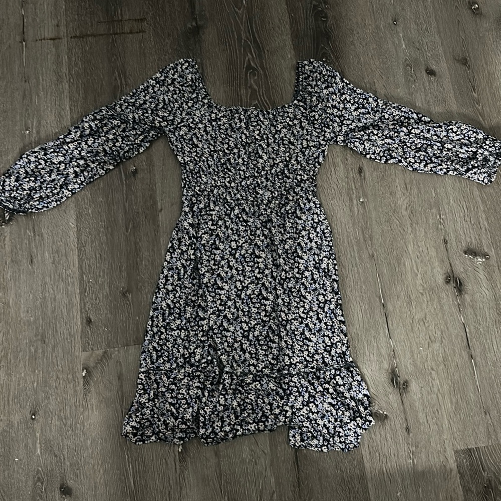 Short blue floral dress with square neckline.